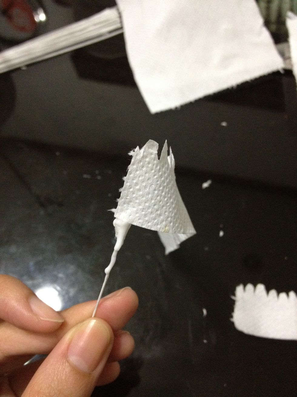 Place the paper on to the cotton.