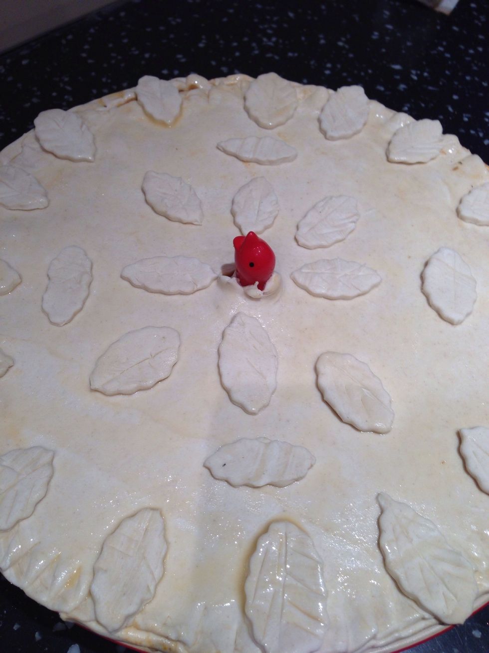 Place the pastry over the pie dish and decorate