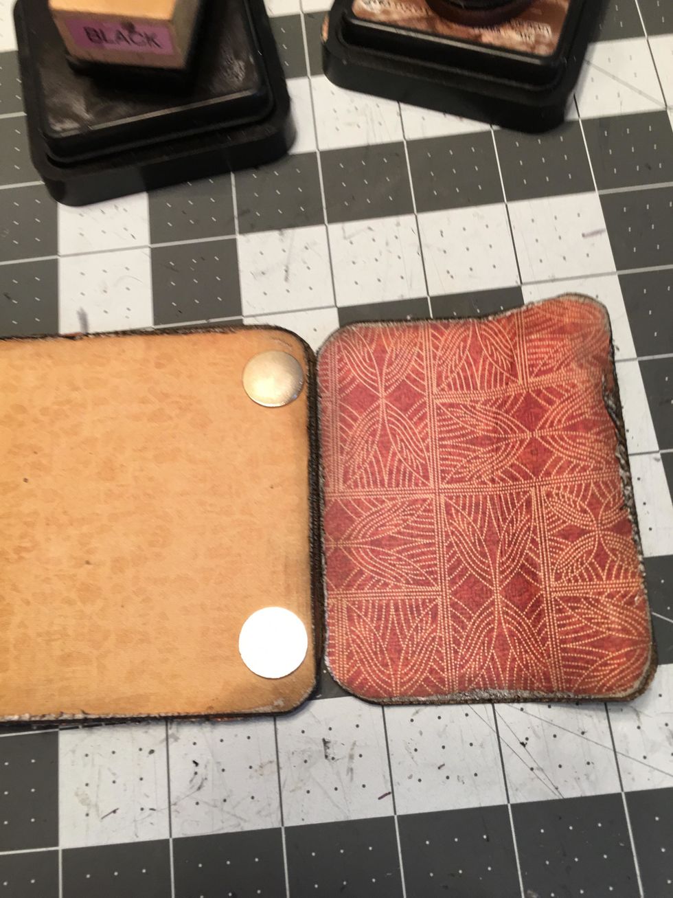 Place the patterned front black tag on top of the back tag with the wrap piece. Peel of the backing from the two magnets and "close up" the wrap flap onto the front tag. Gently open back the flap.