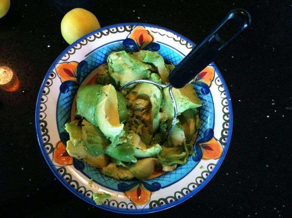Place the peeled avocado in the bowl.