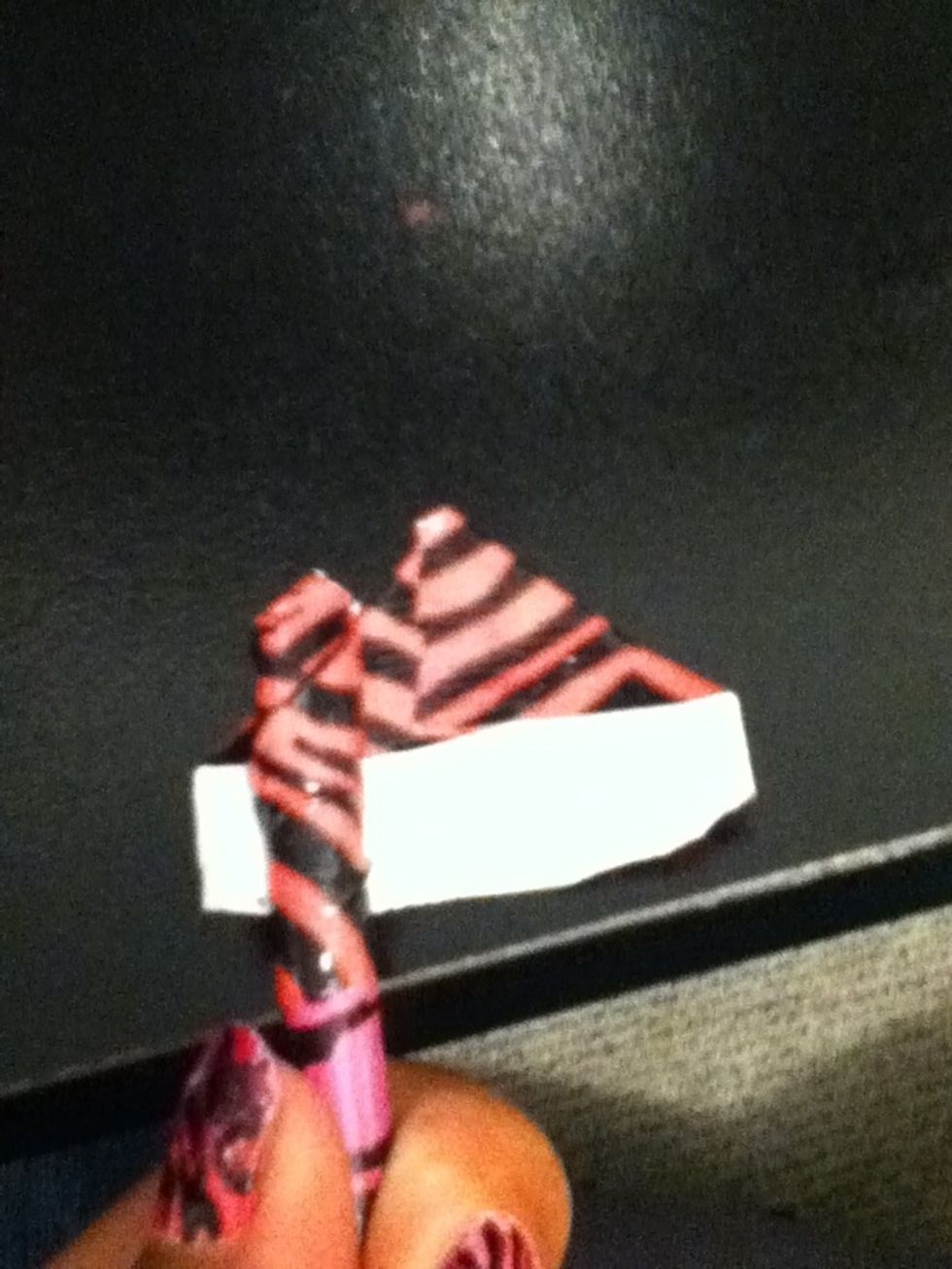 Place the pencil like this on another piece of duct tape.