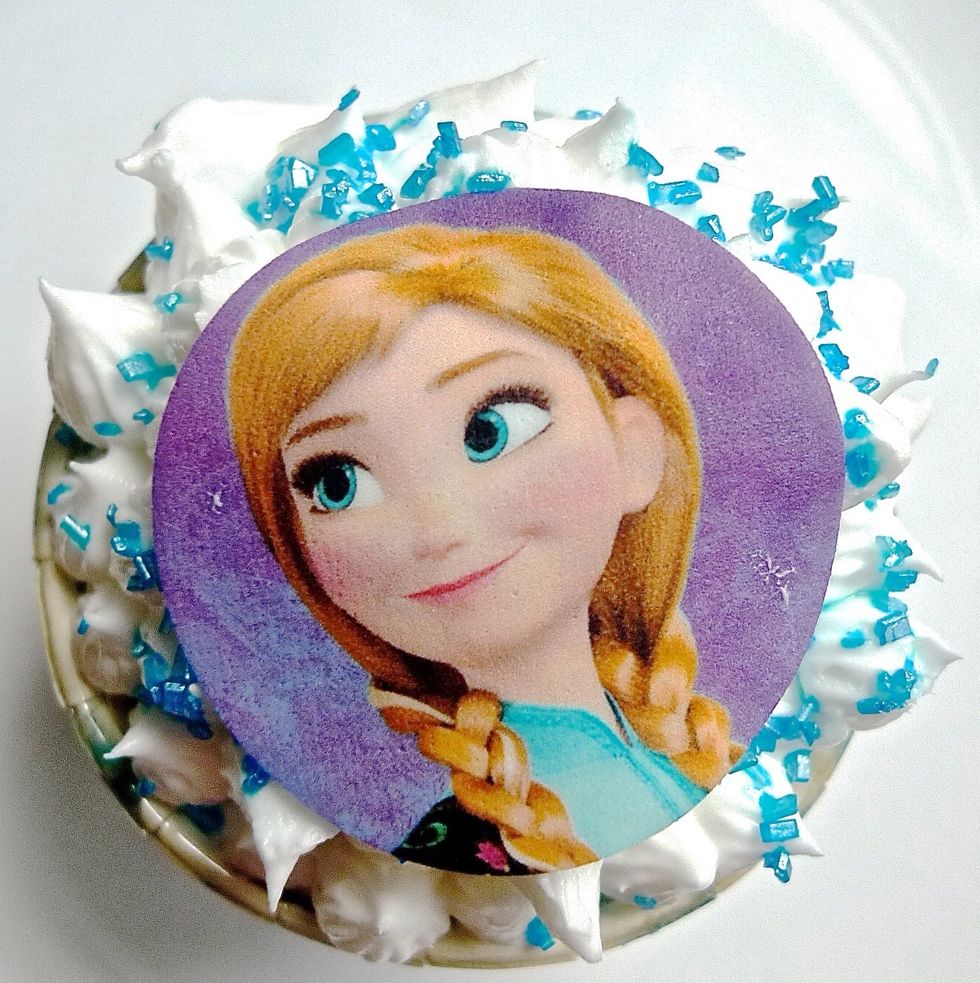 Place the photo cupcake topper on the top of the frosted cupcake. Make sure to put a little frosting on the underside of the print before putting on the cupcake. And you're done!