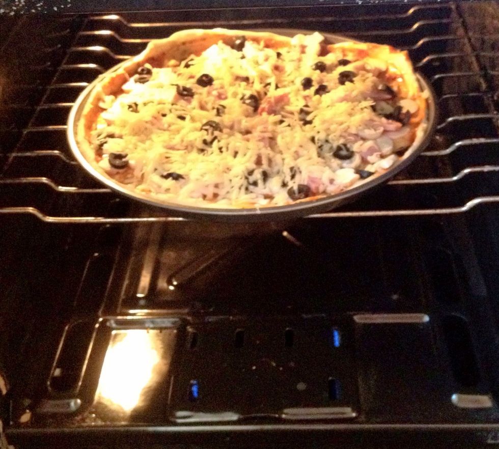 Place the pizza in a hot oven with small fire for about 30 minutes.