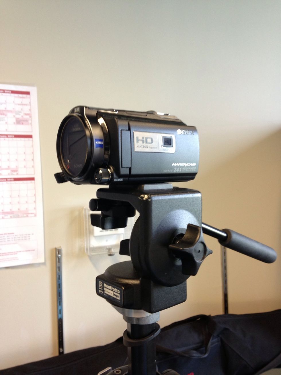 Place the plate back in by snapping it into the tripod head on one side. You may need to pull back the latch on the tripod to insert the plate in. Make sure it is locked in place before continuing.