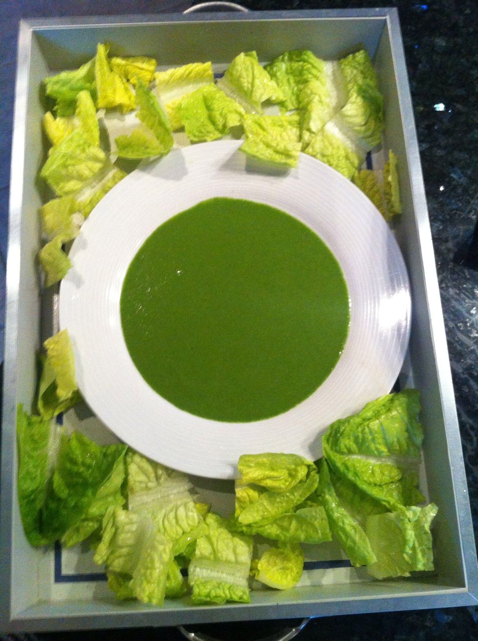 Place the plate with 40 % of dressing on a serving dish , cut roman lettuce and place it around the plate