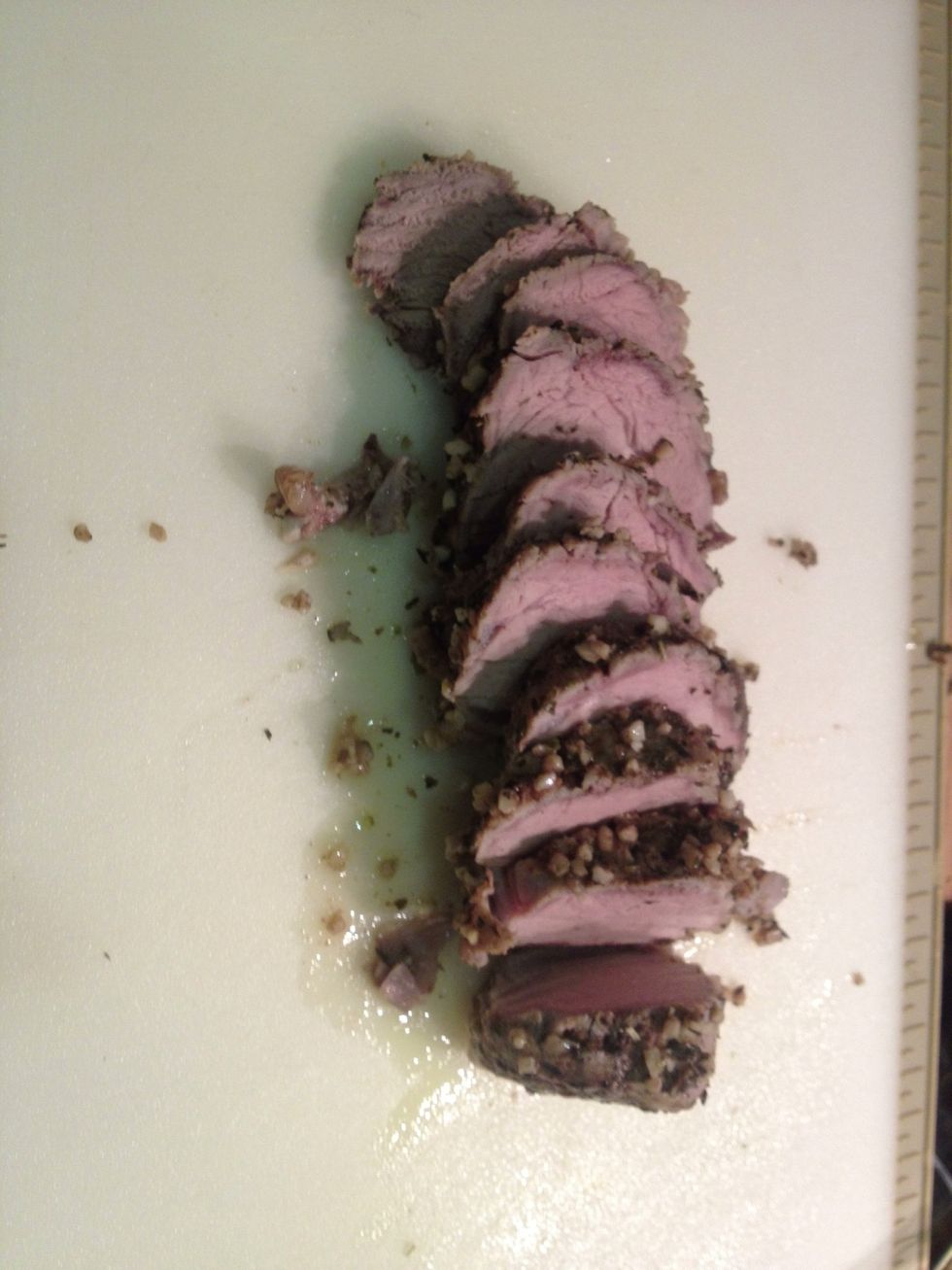 Place the pork onto a chopping board and slice into medallions.
