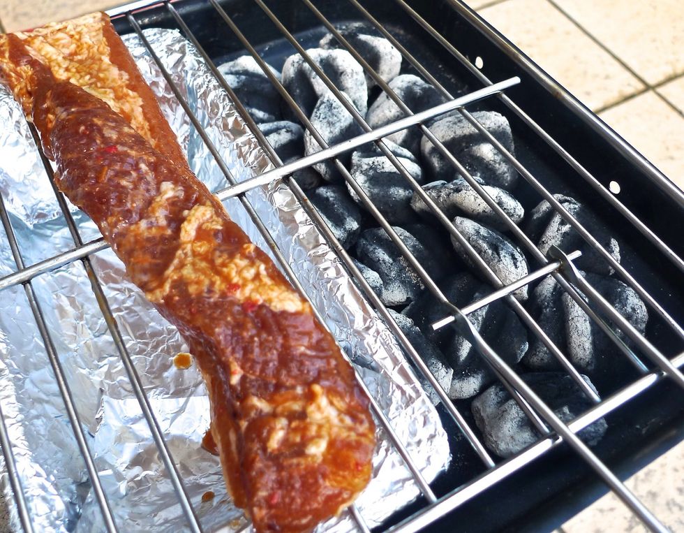 Place the pork strip on the oiled grate. Cook the pork strip on the grate over INDIRECT heat for 15 to 20 minutes or until about cooked.