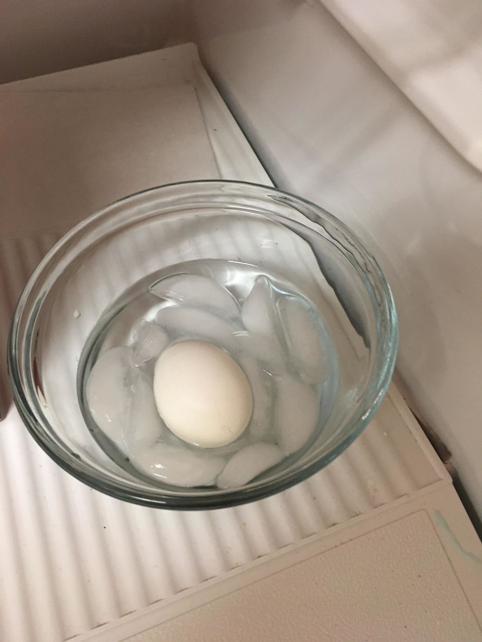 Place the pot in the sink and let cold water run in it. It's okay if it overflows. Then carefully place the eggs in cold ice water for 5 minutes. Then take them out. Ready to peel!