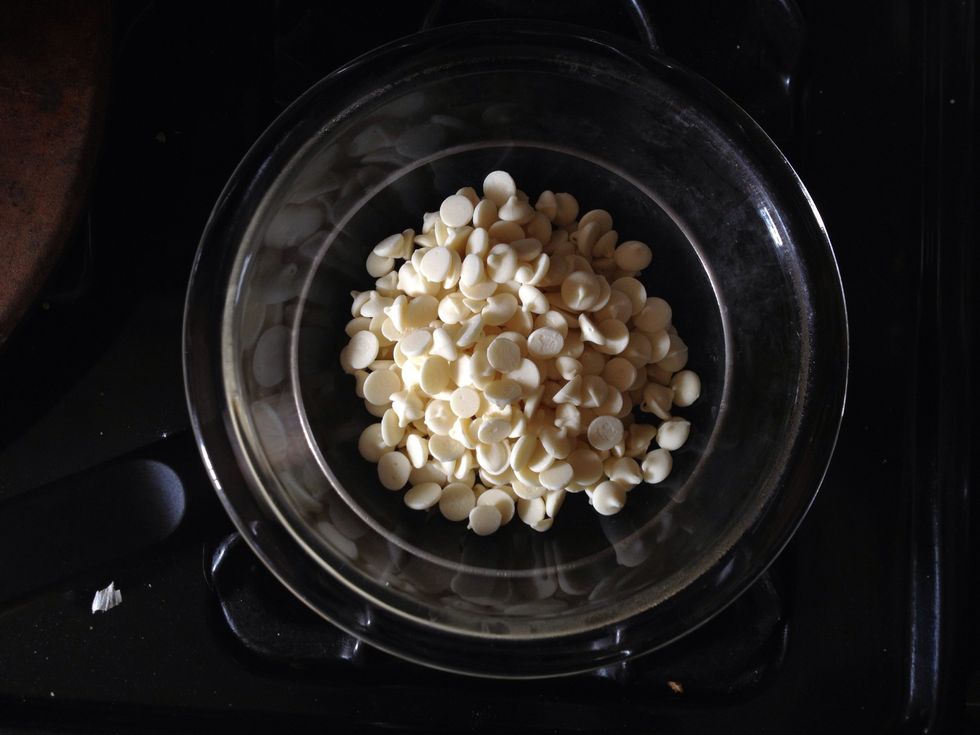 Place the pot over medium high heat and add the chocolate to the top bowl.