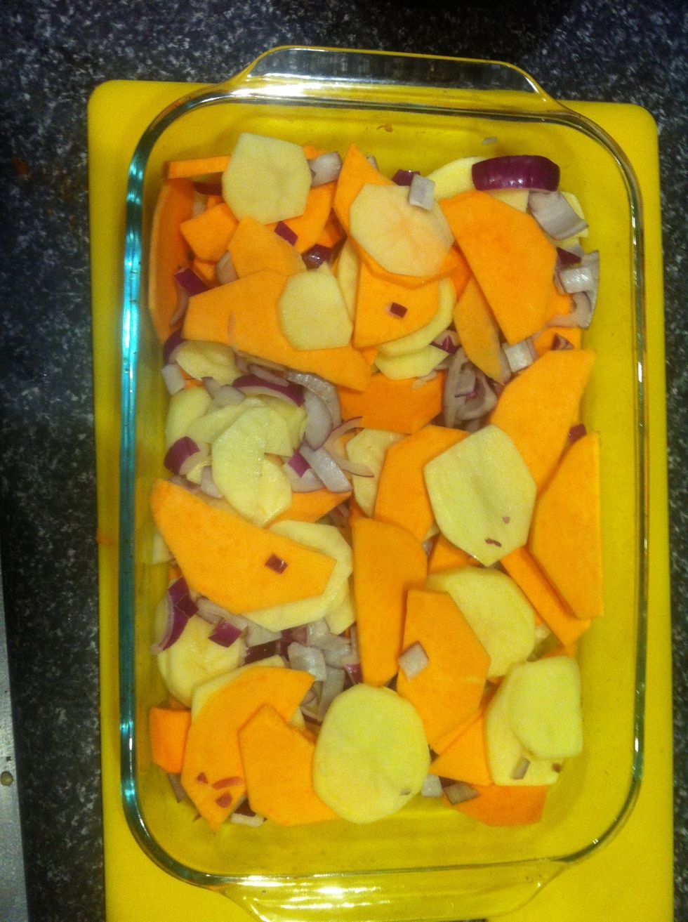 Place the potato, sweet potato and onion in an oven proof dish