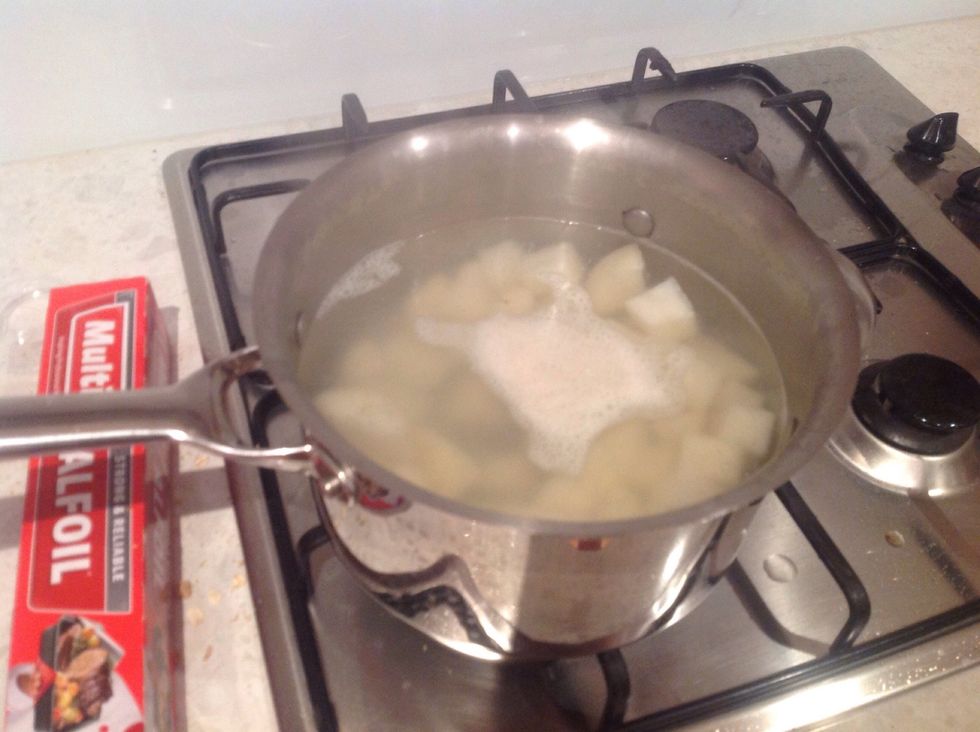 Place the potatoes in salted boiling water and cook for 10 - 15 mins or until potatoes are soft. When done let drain and let potatoes cool in a bowl
