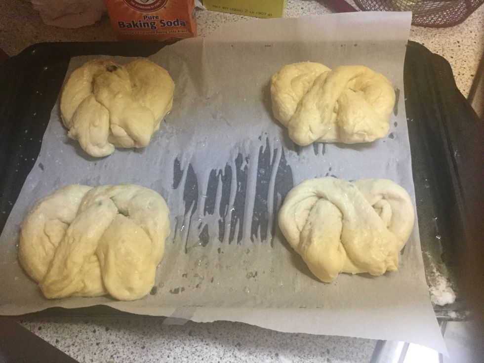 Place the pretzels on parchment paper on a tray, no more than 4 per tray. Place them in the preheated oven for 18 minutes or until dark brown. Clean while you wait, this stuff makes a mess.
