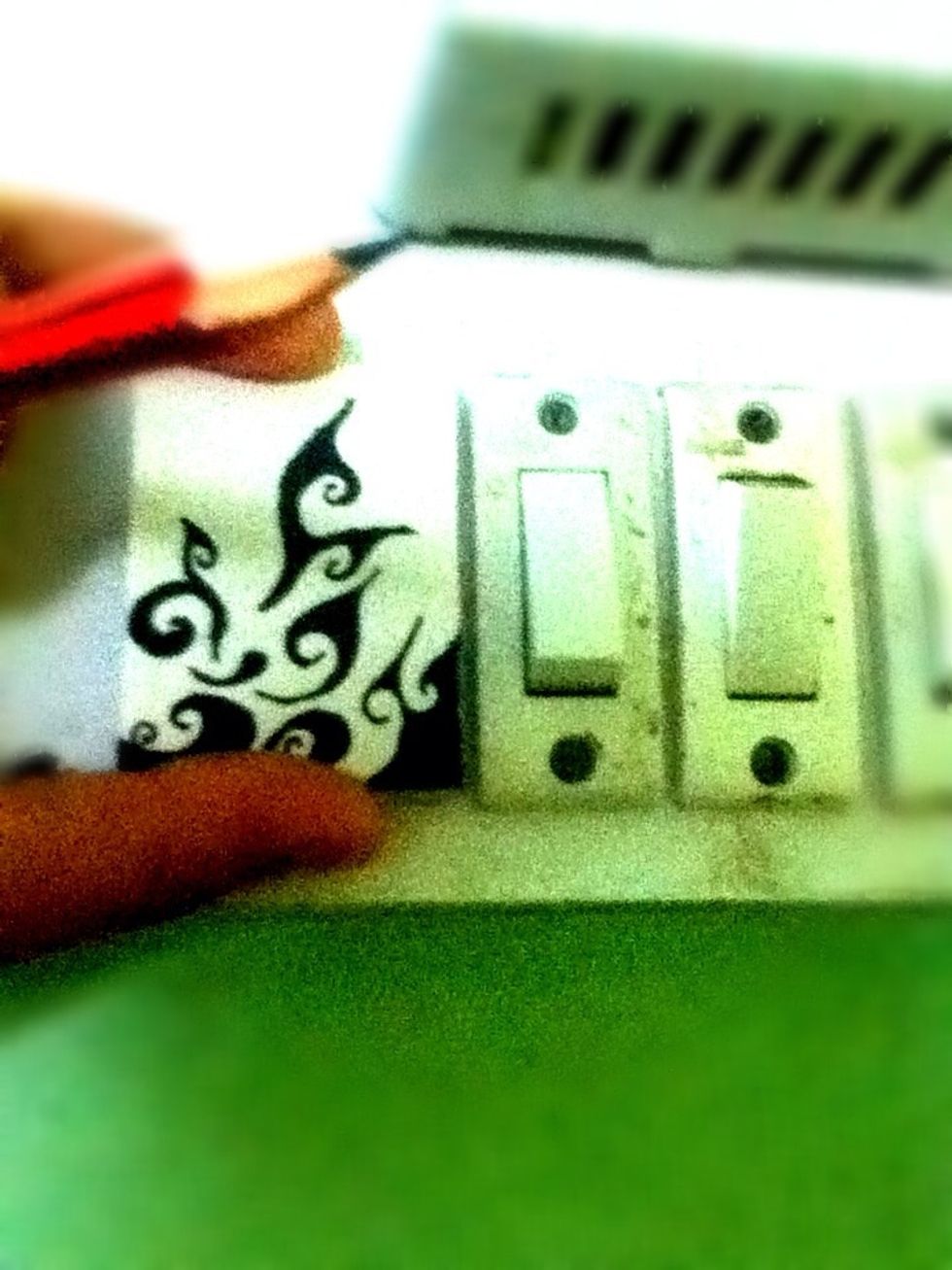 Place the rectangle on the on light switch plug and mark the places where the holes are..