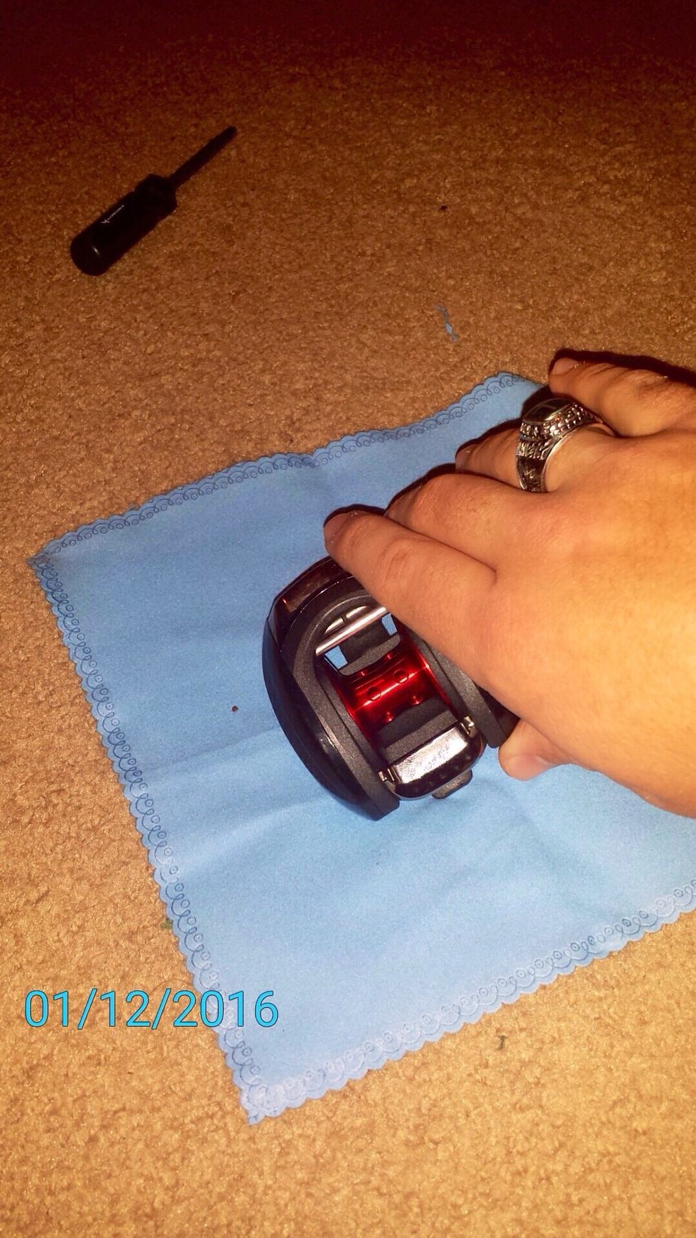 Place the reel on a soft cloth.