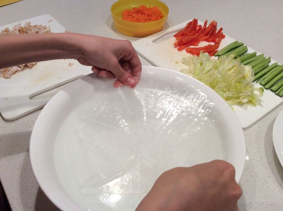 Place the rice paper in the bowl of water so all of its surface is covered, leave until it is soft