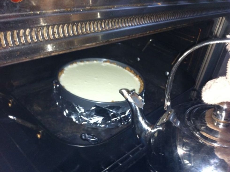 Place the roasting pan in the preheated oven and pour the very hot water into the roasting pan , NOT in the springform pan.