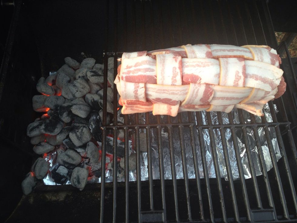 Place the roll on your grill. I'm using a charcoal grill and have offset the coals to one side.  Cook for 30 minutes at 375 degrees. Then turn the roll. Cook for another 30 minutes.