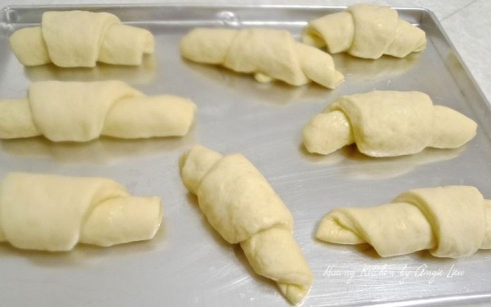 Place the rolls point side down onto ungreased cookie sheet. Cover the rolls with a clean kitchen towel and put the cookie sheet in a warm place.