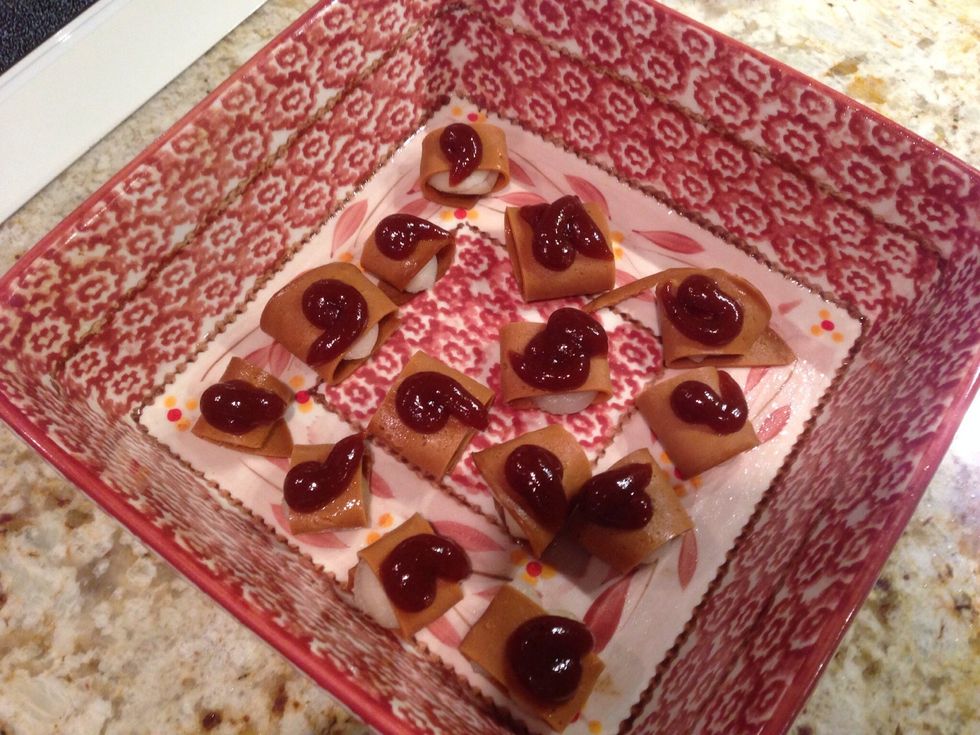 Place the rollups in a greased pan with the overlapped side on the bottom. Top each rollup with a generous amount of BBQ sauce.