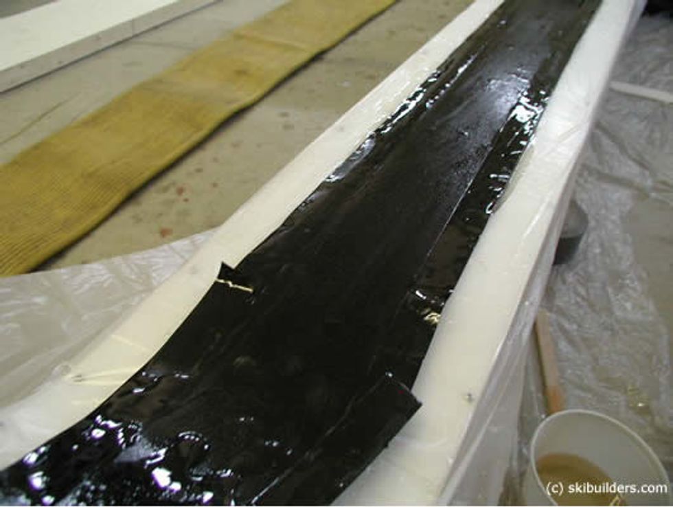 Place the rubber dampening strips over the base with epoxy on it