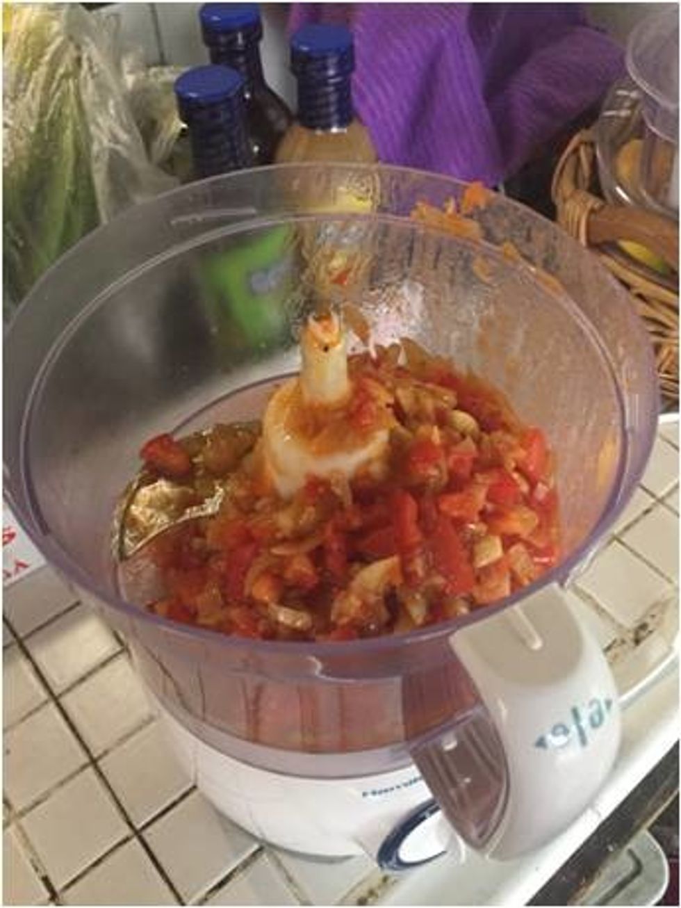 Place the saut\u00e9ed sofrito ingredients into a food processor.