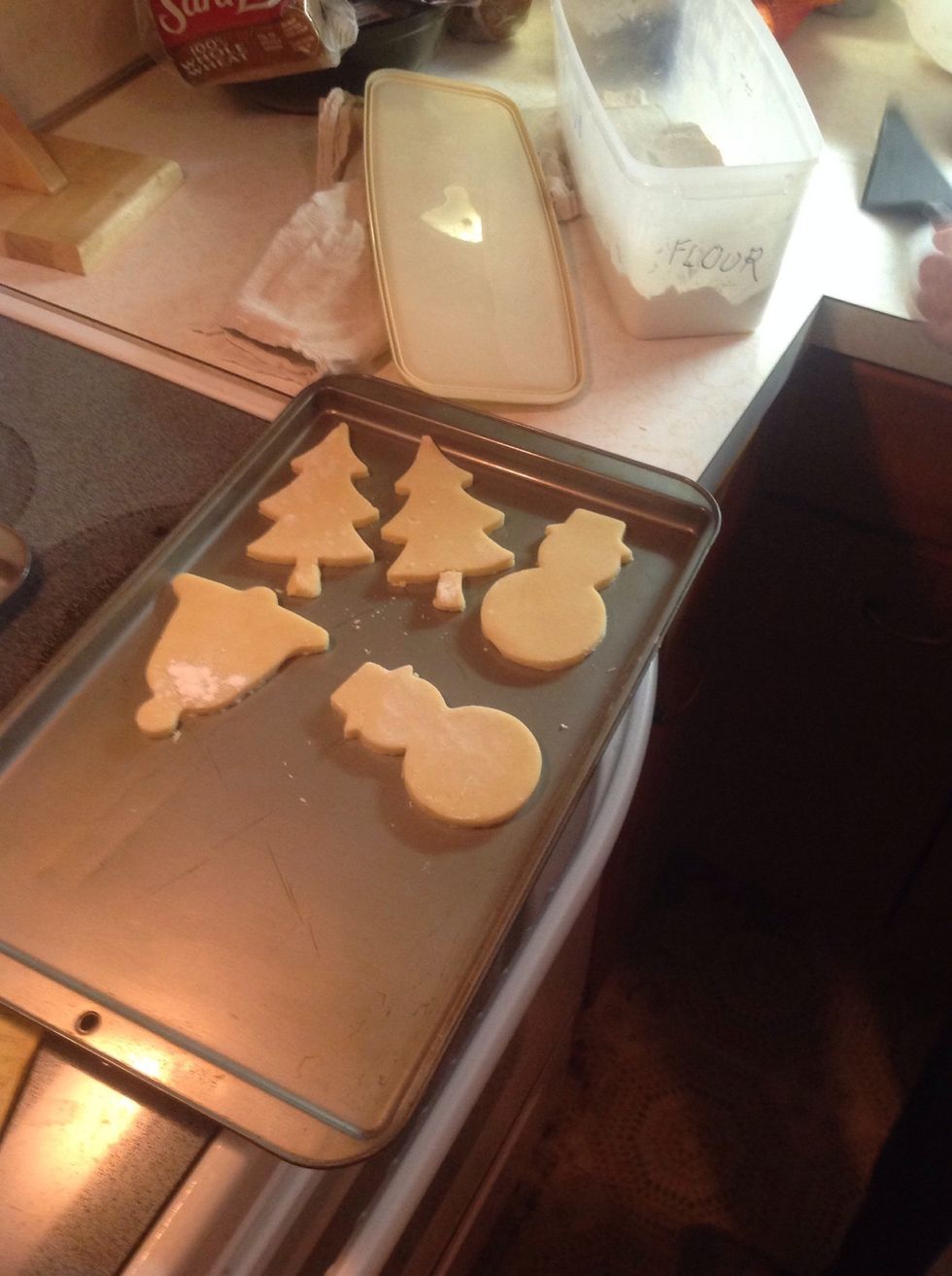 Place the shapes on a cookie sheet.