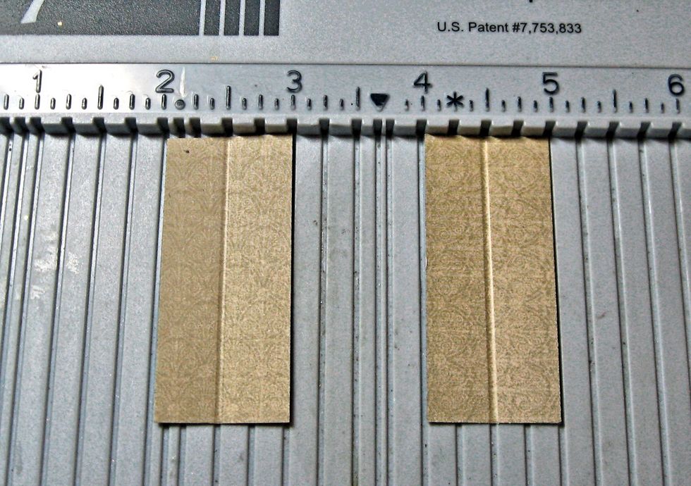 Place the short end on your scoring tool and score each at 1/2" . Crease.