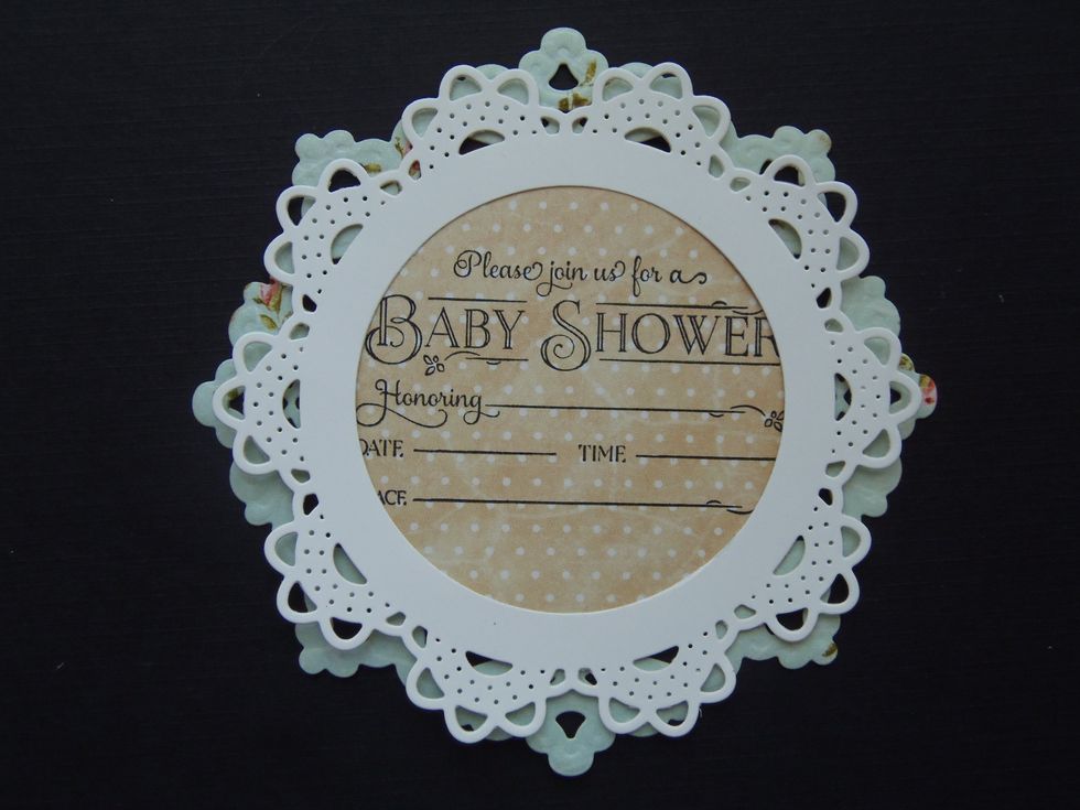 Place the smaller doily on the bigger one-make sure they are centered. DO NOT GLUE TOGETHER. Notice that I've cut out a circular window on the center of the smaller doily -this is optional.