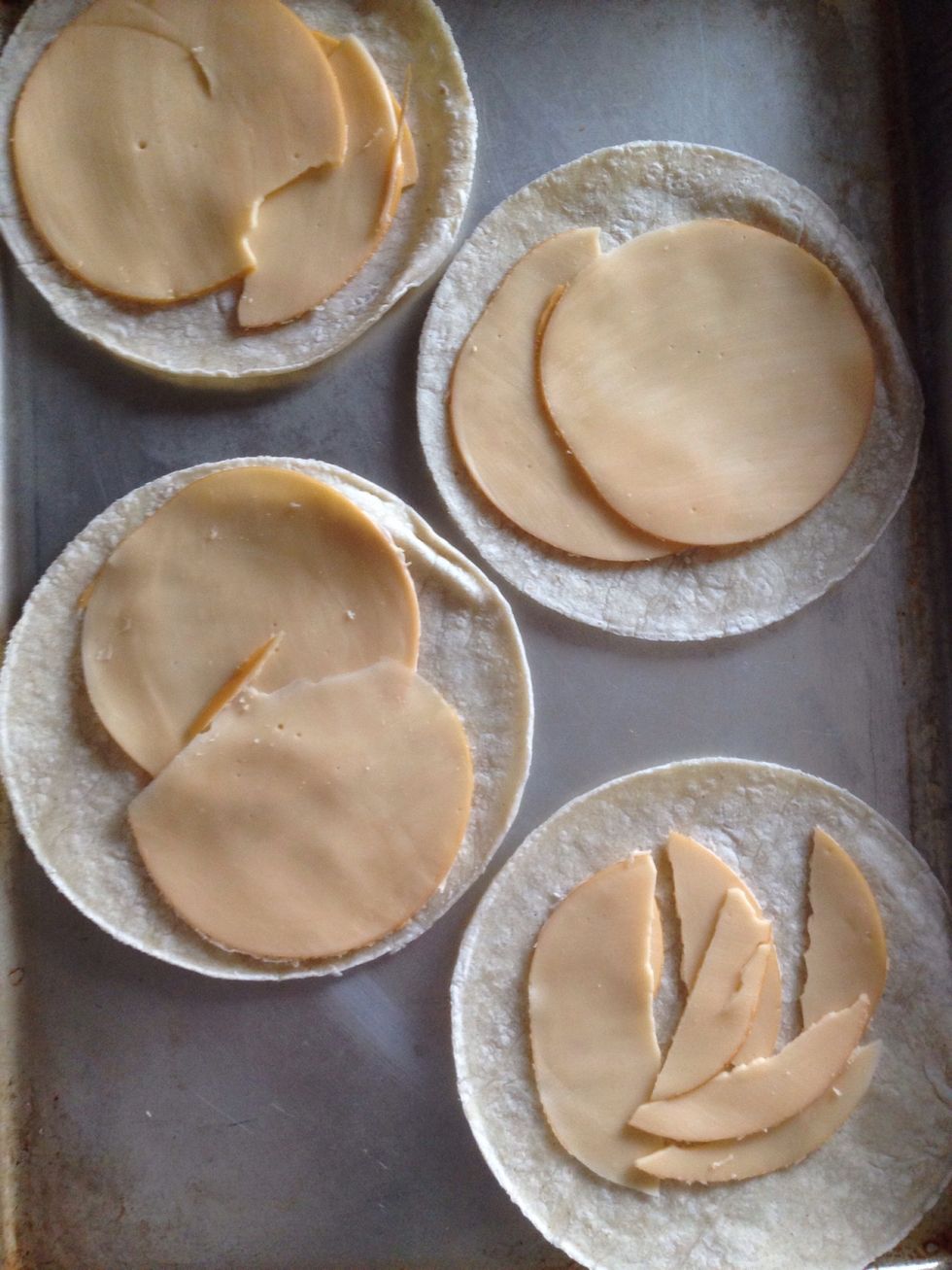 Place the smoked Gouda on the tortillas, I bought sliced cheese so I didn't even need to grate it myself.