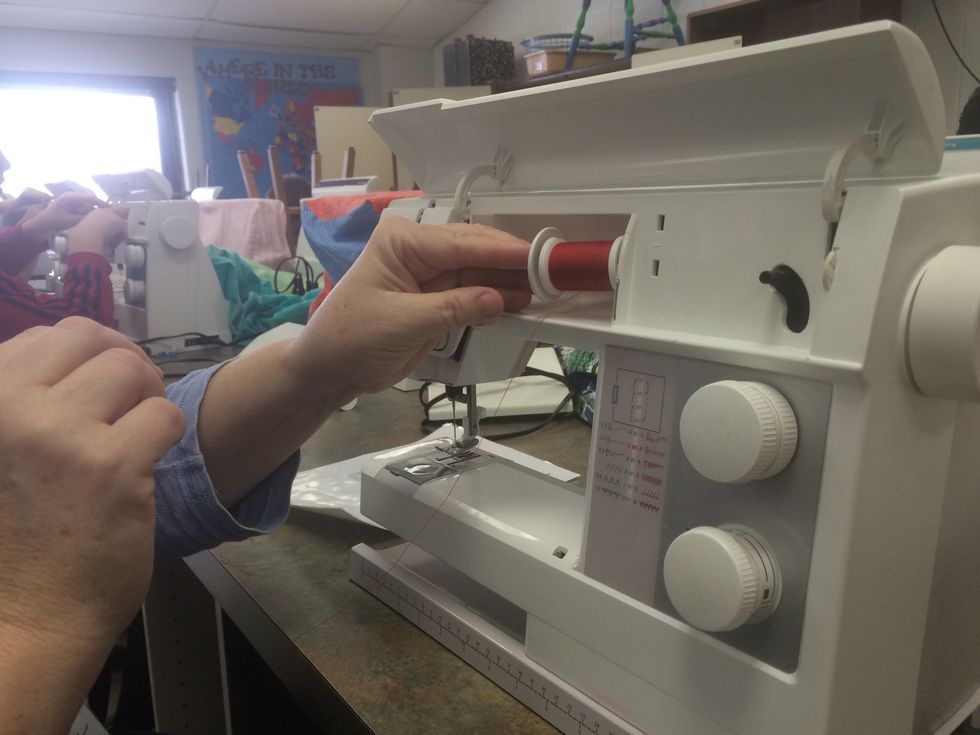 Place the spool holder back on the spool pin