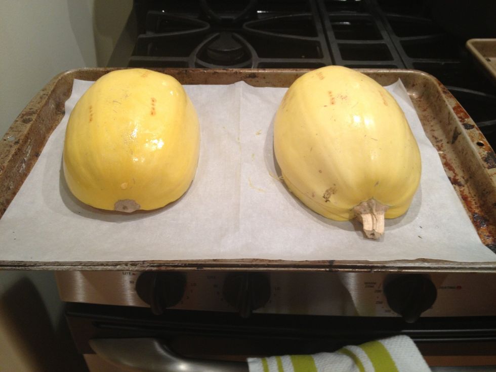 Place the squash halves cut side down on a baking sheet. Make sure it has been oiled or covered in parchment paper.