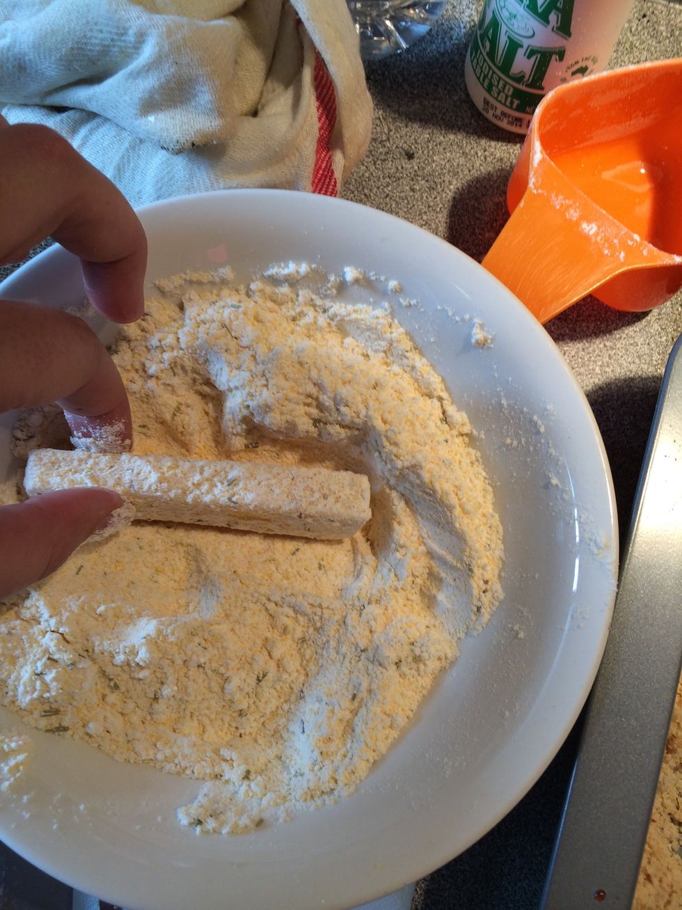 Place the stick in the flour mixture.