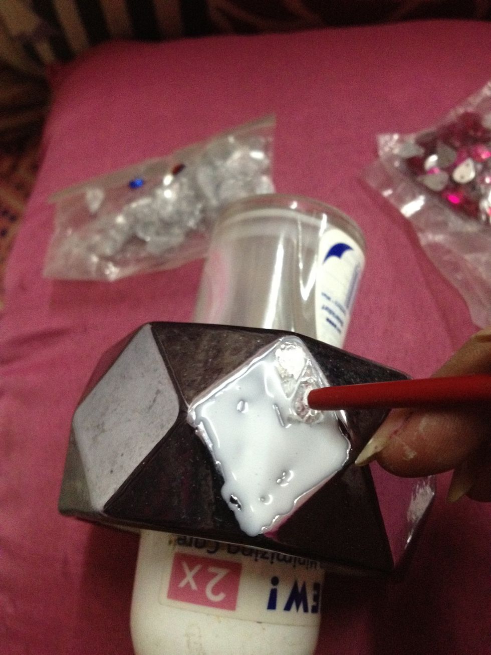 Place the stones however u like!!use the brush to adjust the stones by pushing it around..dont use ur hand it ll get messy!