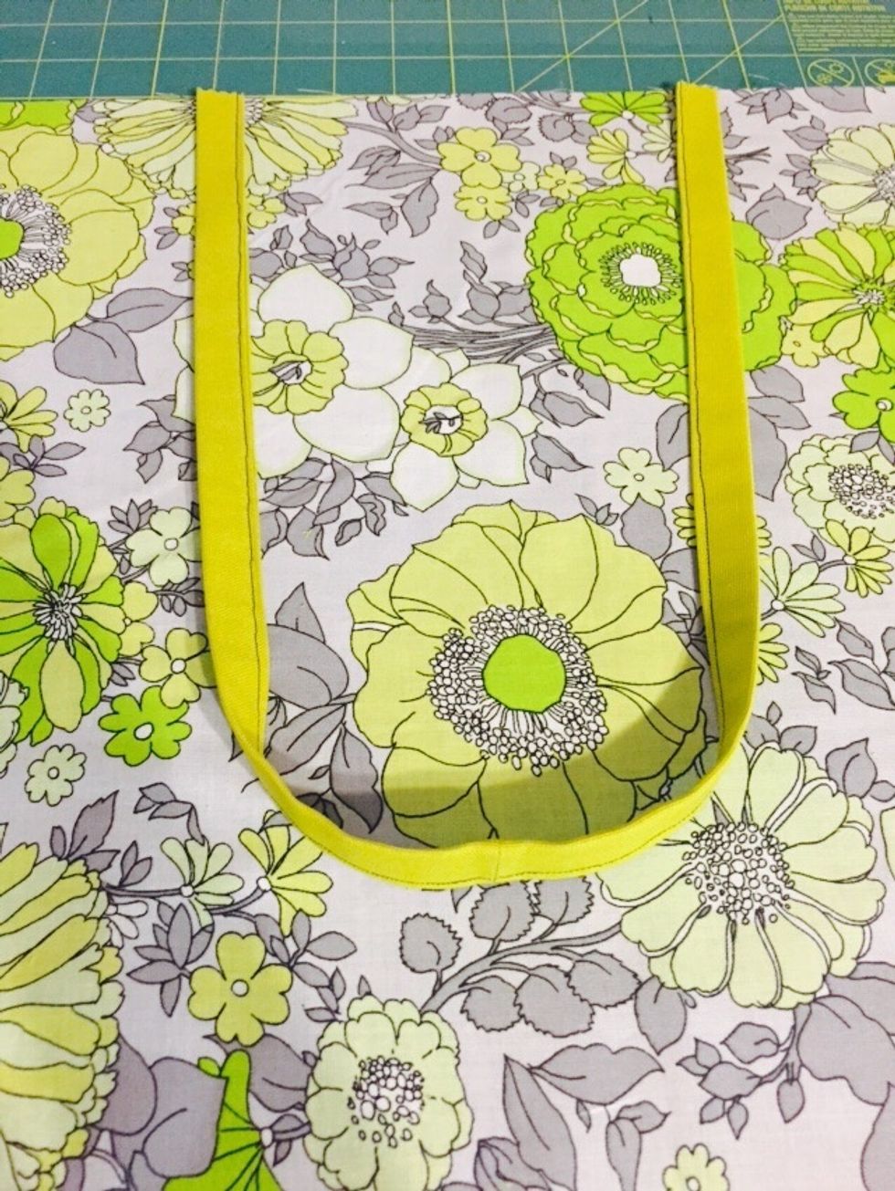 Place the strap on the right side of your main fabric, as shown in the picture. Make sure that your straps aren't twisted before moving to the next step.
