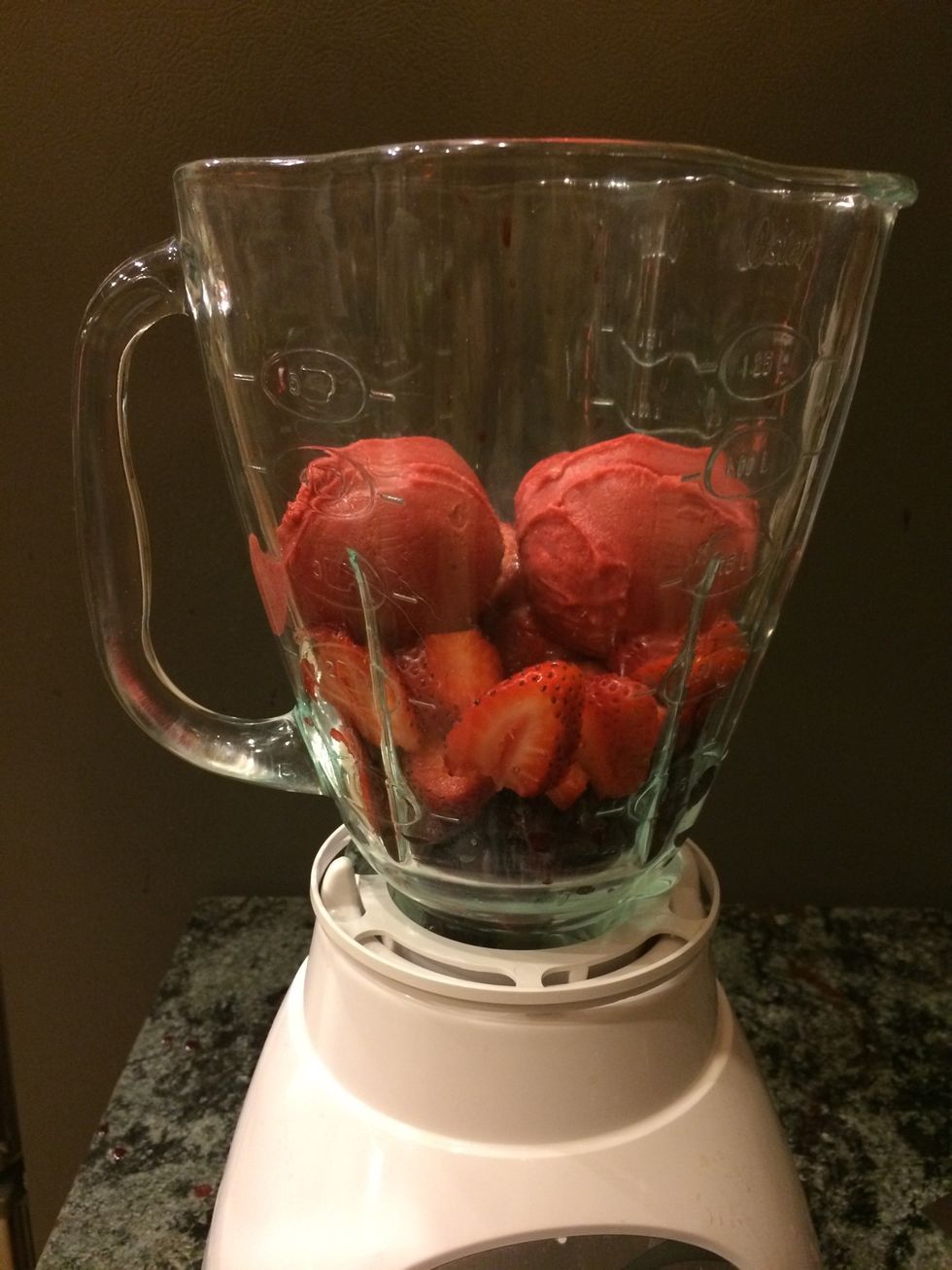 Place the strawberries and cherries in a blender with two scoops of Talenti Roman Raspberry sorbetto. Blend until smooth. Pour mixture into two drinking glasses about a third of the way full.