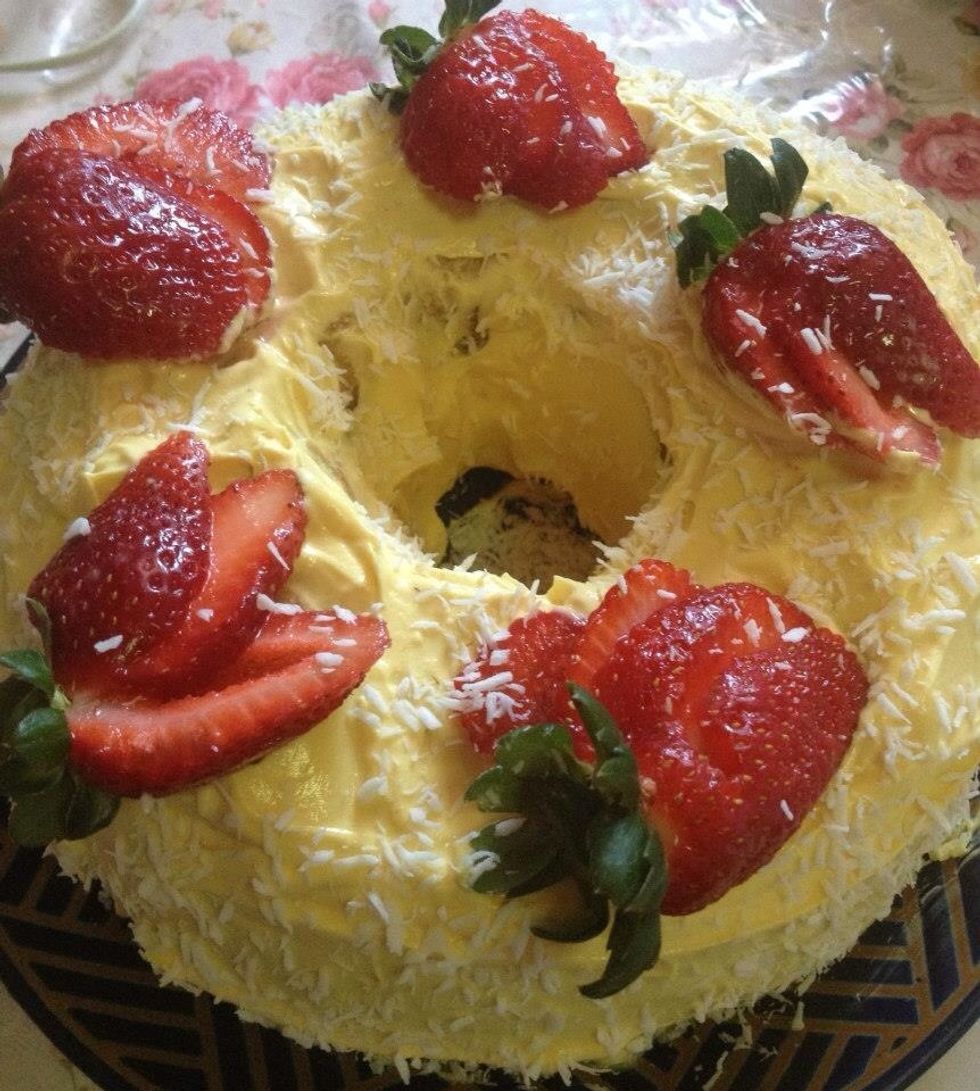 Place the strawberries then sprinkle coconut