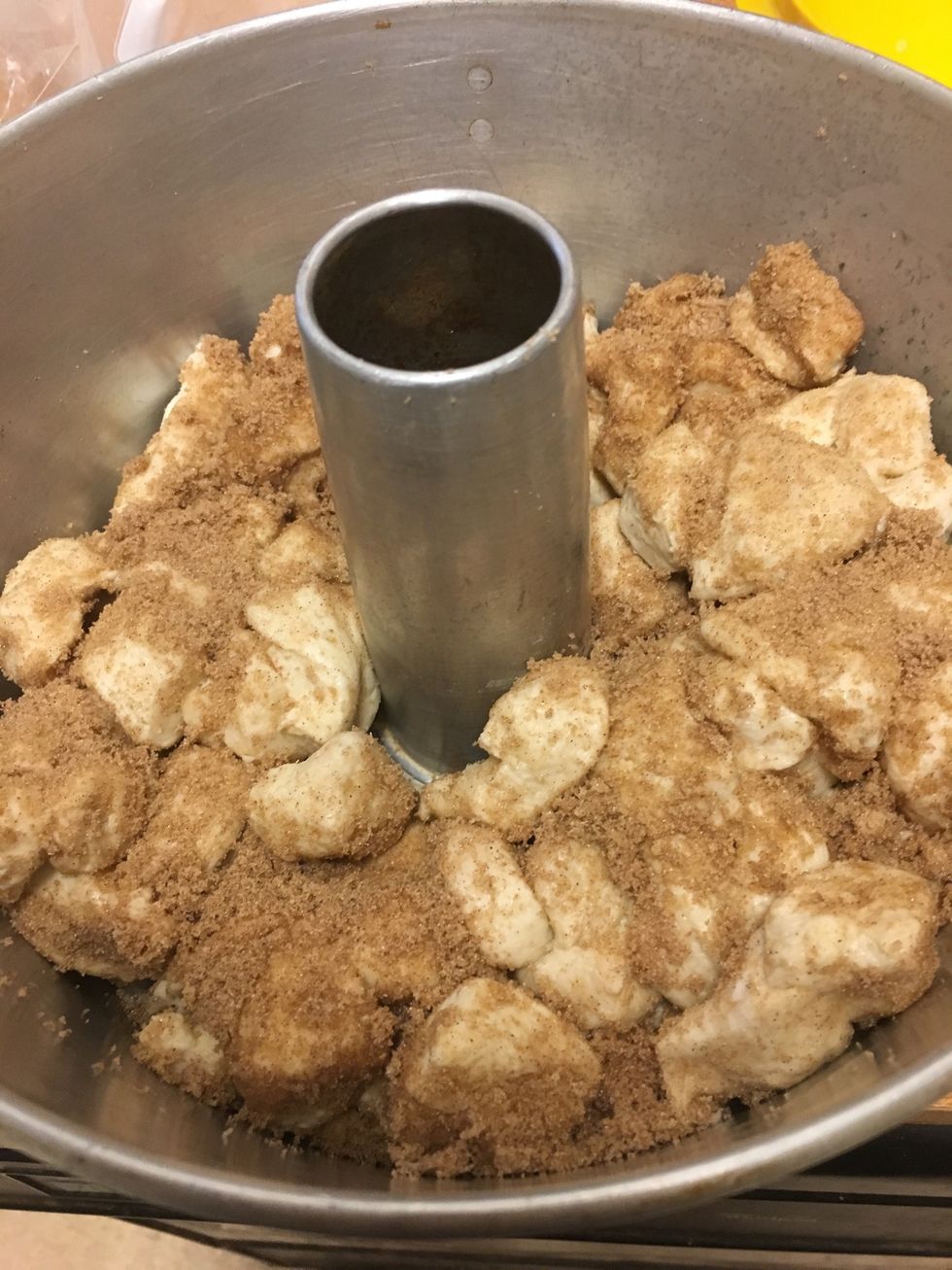 Place the sugar and cinnamon dough into bundt pan