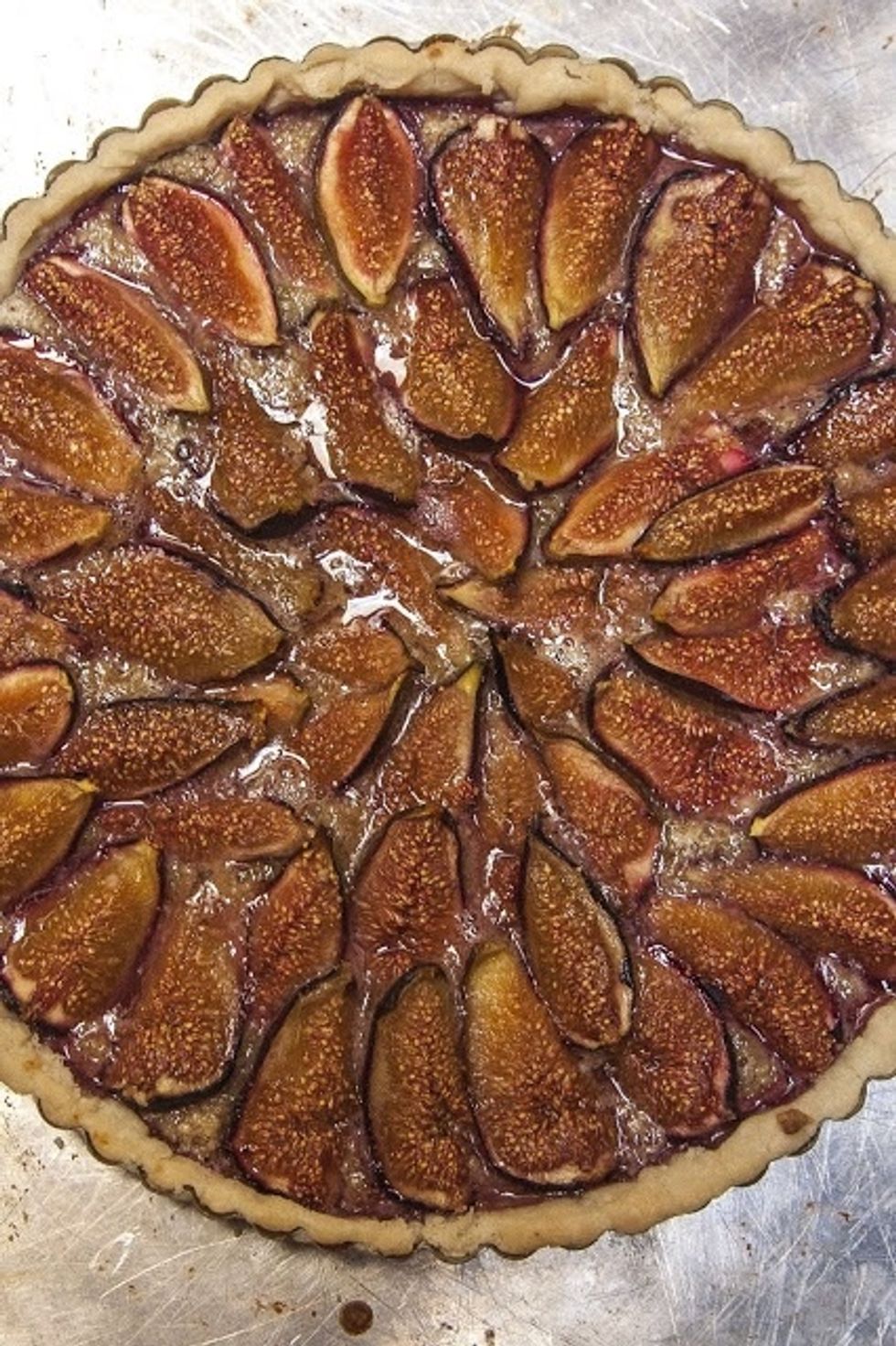 Place the tart on a cooling rack, then slip the rim of the tart pan off