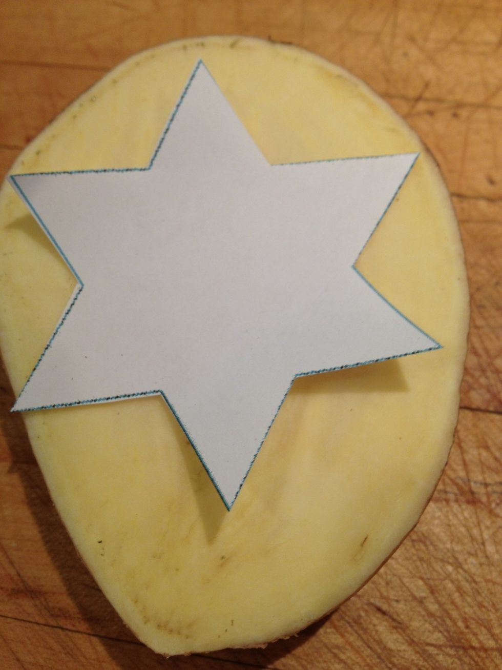 Place the template on another potato half.