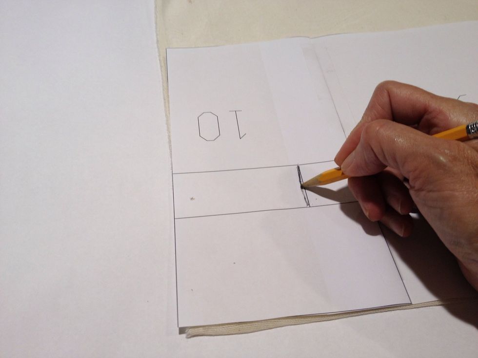 Place the template on the in the top of the panel, aligning it with the fold at the top and the sides of the curtain. Mark all the buttonholes across the top of the panel.