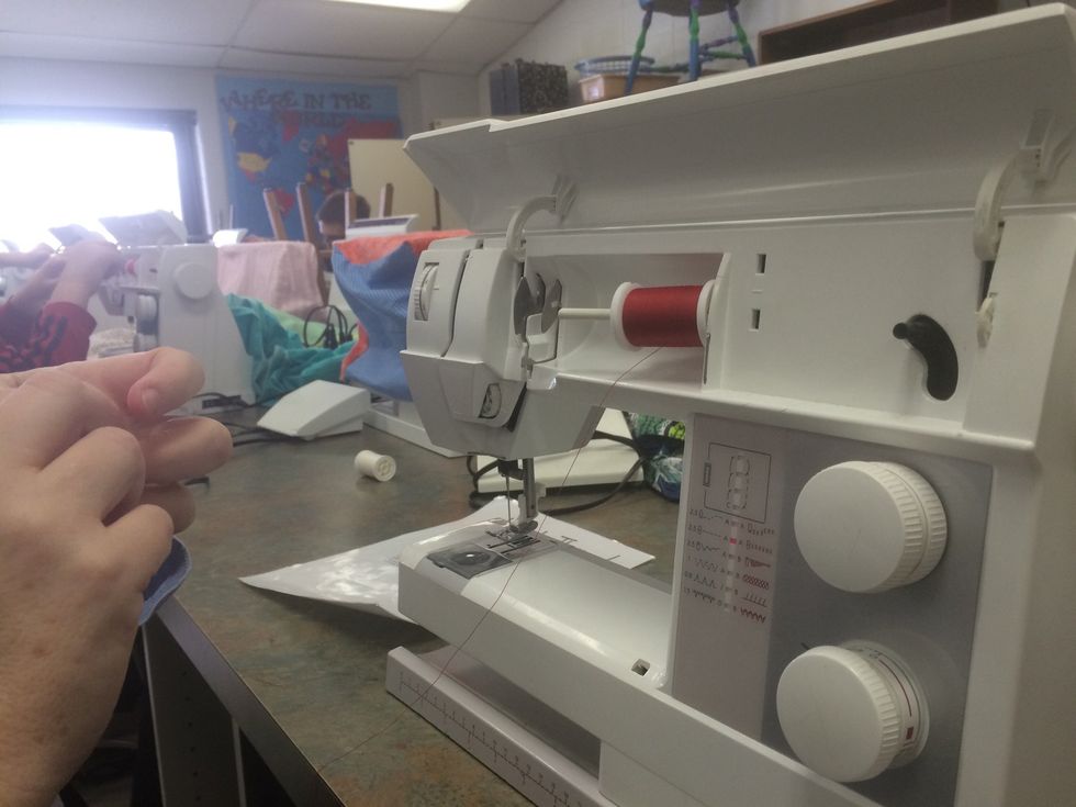 Place the thread on the spool pin