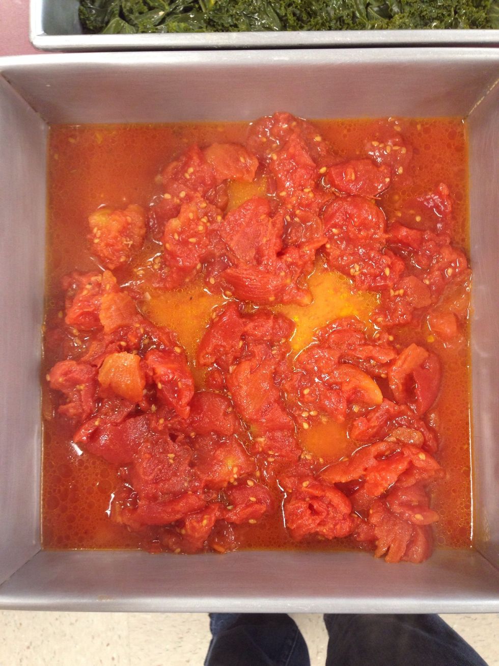 Place the tomatoes on the bottom of an 8x8 baking dish, spread as evenly as possible