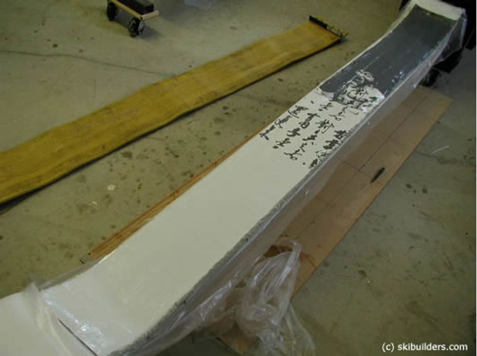 Place the top sheet layer with graphics to the top