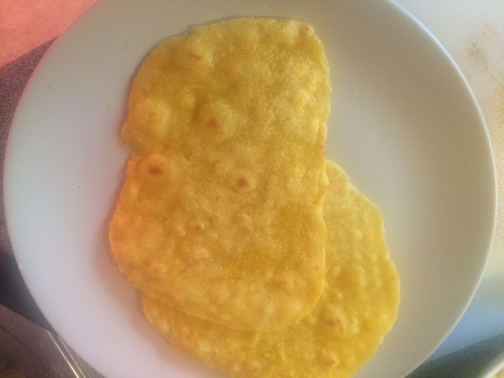 Place the tortillas onto a plate.