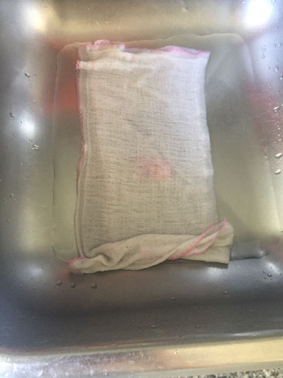 Place the towel in the water