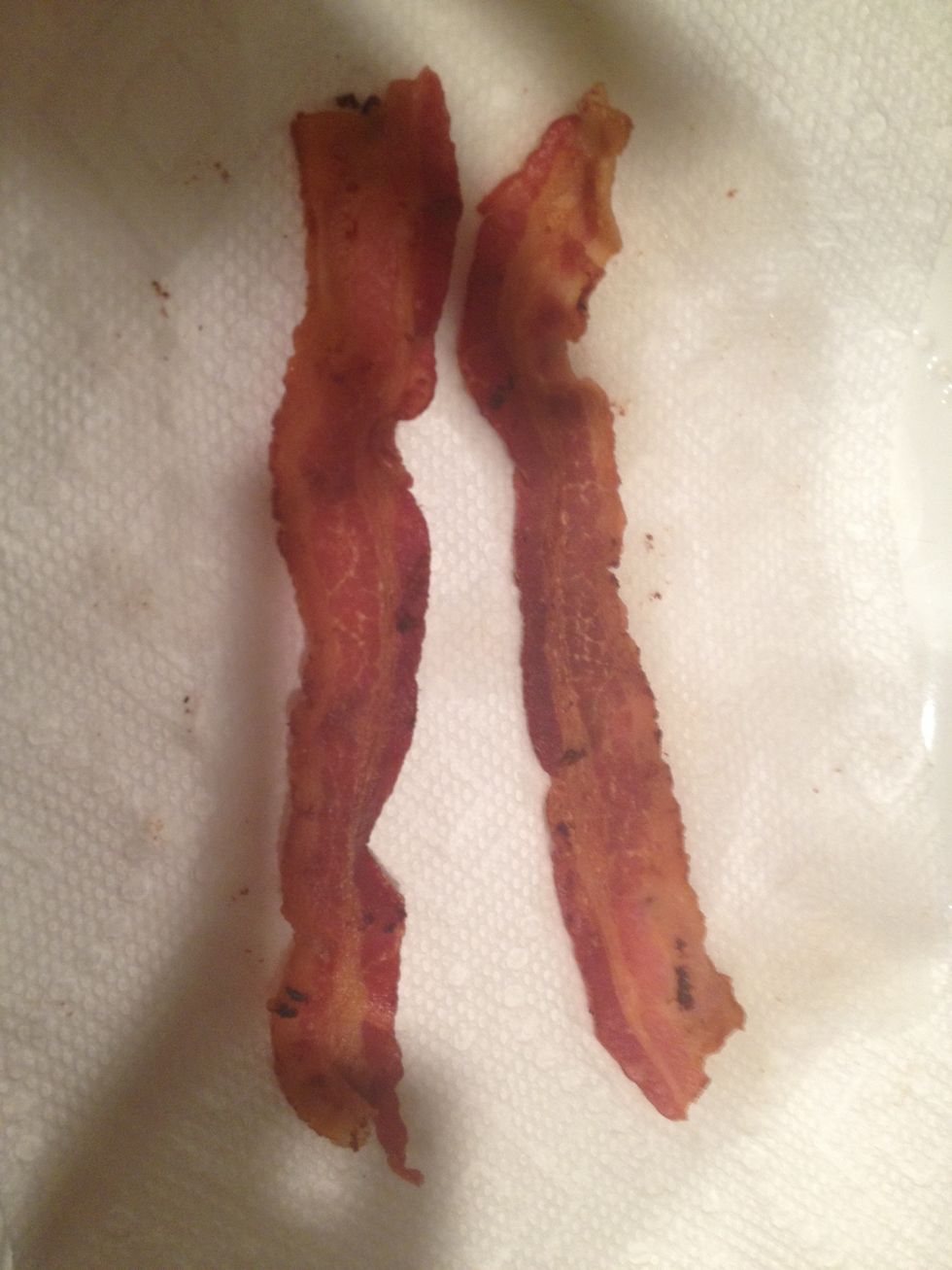 Place the two pieces of pure amazement onto a plate covered with a paper towel to remove some grease
