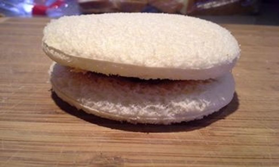 Place the two slices with the peanut butter and jelly sides together.