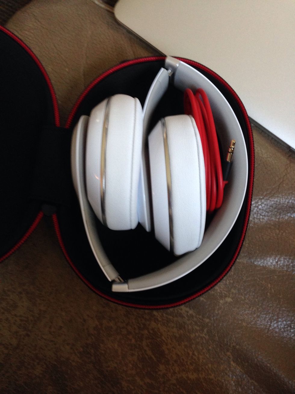 Place the unraveled audio cable into the space by the headband. The cord should fit perfectly.