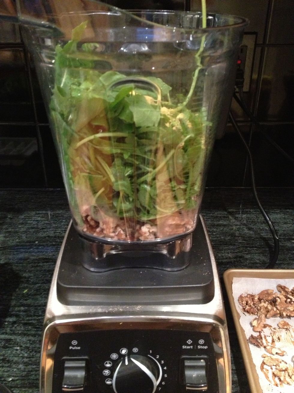 Place the walnuts, arugula, garlic, nutritional yeast and olive oil in a food processor or high powered blender, such as a Vitamix.