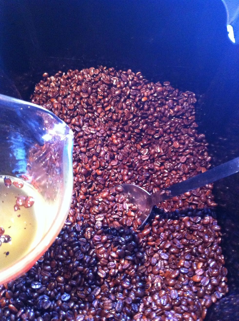 Place the warm beans in the container and using a metal spoon dip into the oil and then stir into the beans. Keep repeating this process until all the oil is used up.